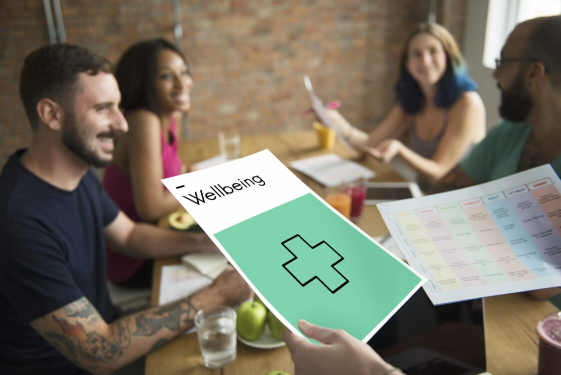 Five Digital Volunteers having a meeting to promote general wellbeing. 